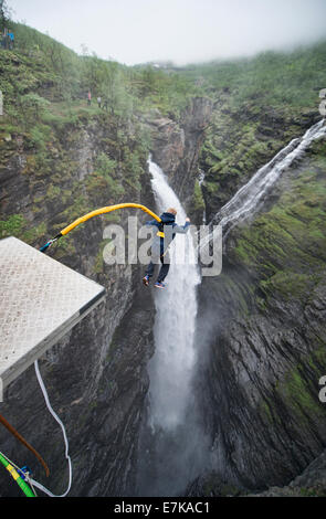 bungee jumping into a waterfall from the Gorsa Bridge in northern Norway Stock Photo