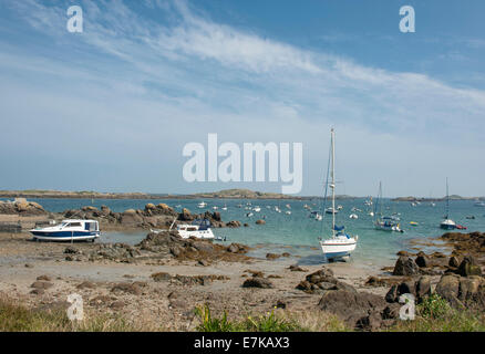 Boats moored at low tide in a bay of the Chausey Channel at Grand-Île, Chausey Islands, Basse-Normandie, France