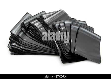 Black packaging bags with zipper different sizes. White background. Stock Photo