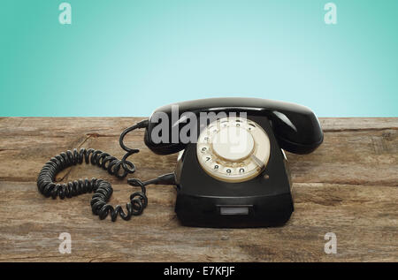 Retro telephone on wooden table Stock Photo