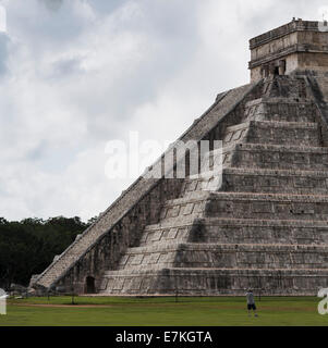 One man taking pictures of the Kukulkan Pyramid (El Castillo) Chichén Itzá, Mexico Stock Photo