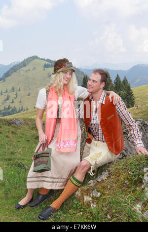 Bavarian couple in love in traditional costume clothing Stock Photo