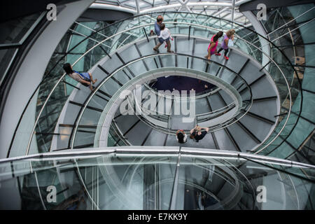 London, UK. 20th September, 2014. visitors on the spiral staircase of City Hall during the first day of Open House London, the annual event organised by Open-City, offering the chance to explore hundreds of inspiring buildings in London for free. Credit:  Piero Cruciatti/Alamy Live News Stock Photo