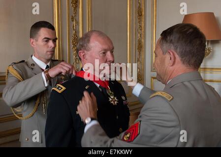 US Chairman of the Joint Chiefs Gen. Martin E. Dempsey  is awarded the Legion of Honor by French Chief of Defense Staff Gen. Pierre de Villiers during a ceremony September 18, 2014 in Paris, France. Stock Photo