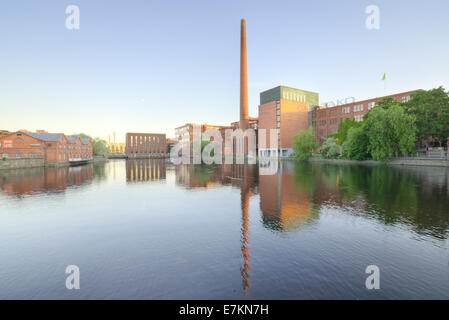 Landscape of an old brick factory and lake reflection at dusk in Tampere Finland Stock Photo