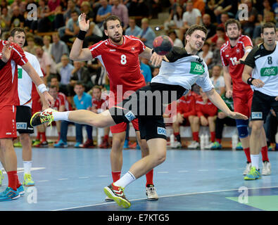 Goeppingen, Germany. 20th Sep, 2014. Germany's Hendrik Pekeler (R) and Switzerland's Fabio Baviera in action during the Handball match between Germany and Switzerland in Goeppingen, Germany, 20 September 2014. Photo: DANEIL MAURER/dpa/Alamy Live News Stock Photo