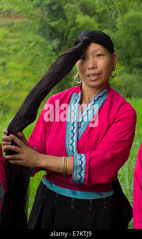 Yao woman of Longji area demonstrating her long hair. Stock Photo