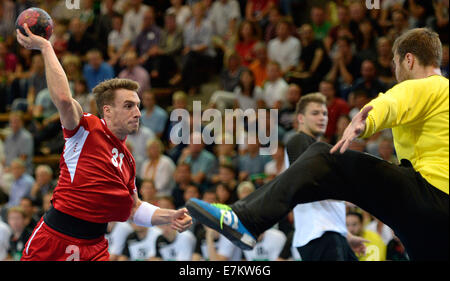 Goeppingen, Germany. 20th Sep, 2014. Germany's Andreas Wolff (R) and Switzerland's Luca Linder in action during the Handball match between Germany and Switzerland in Goeppingen, Germany, 20 September 2014. Photo: DANEIL MAURER/dpa/Alamy Live News Stock Photo