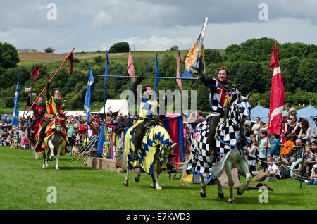 Knights taking part in a medieval jousting tournament at Linlithgow Palace, Scotland. Stock Photo