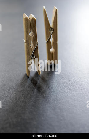 wooden clothes pegs on the table, close up Stock Photo