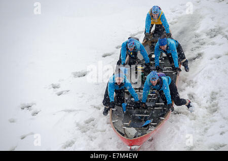 MONTREAL - FEBRUARY 23: George 5 women's team at the Montreal Ice Canoe Challenge on St. Lawrence River Stock Photo