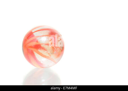 Single orange crystal marble isolated on white Stock Photo