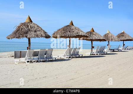 Row of small beach huts in a tropical beach in Panama Stock Photo