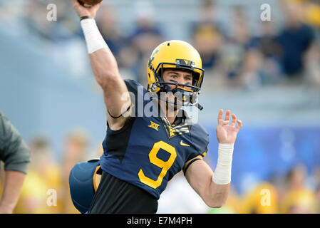 Morgantown, West Virginia, USA. 17th Feb, 2013. West Virginia Mountaineers quarterback CLINT TRICKETT (9) throws a pass during pre game warm-ups in the Big 12 conference football game being played at Mountaineer Field in Morgantown, WV. Credit:  Ken Inness/ZUMA Wire/Alamy Live News Stock Photo