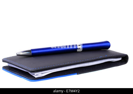 Blue pen over  note pad isolated on a white background Stock Photo