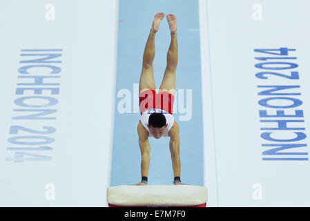 Incheon, South Korea. 21st Sep, 2014. Purevdorj Otgonbat of Mongolia competes during the vault of men's gymnastics artistic event at the 17th Asian Games in Incheon, South Korea, Sept. 21, 2014. Credit:  Zheng Huansong/Xinhua/Alamy Live News Stock Photo