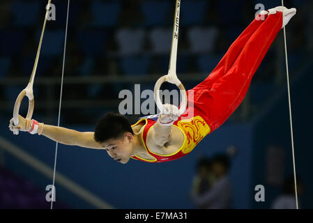 Incheon, South Korea. 21st Sep, 2014. Wang Peng of China competes during the rings of men's gymnastics artistic event at the 17th Asian Games in Incheon, South Korea, Sept. 21, 2014. Credit:  Zheng Huansong/Xinhua/Alamy Live News Stock Photo