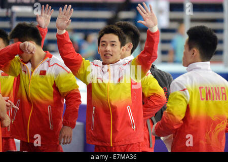 Incheon, South Korea. 21st Sep, 2014. Zou Kai of China greets audiences before the men's gymnastics artistic event at the 17th Asian Games in Incheon, South Korea, Sept. 21, 2014. Credit:  Zhu Zheng/Xinhua/Alamy Live News Stock Photo