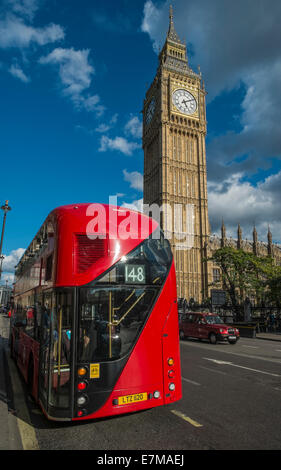 London bus passing Parliament on Westminster Bridge Stock Photo