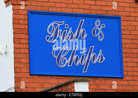 Fish, chips and mushy peas, there is nothing more British than fish and chips. Freshly cooked, hot fish and chips. Stock Photo