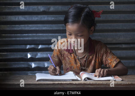 Bandorban, Bangladesh. 20th Sep, 2014. A tribal child is doing his homework Credit:  Zakir Hossain Chowdhury/ZUMA Wire/Alamy Live News Stock Photo