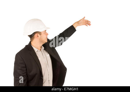 Young Caucasian Male Engineer in Black Coat Showing Something. Captured in Half Body Portrait. Stock Photo