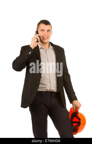 Close up Middle Age Handsome Engineer Talking to Client Through Phone While Holding Orange Helmet in Another Hand. Isolated on W Stock Photo