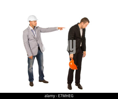 Head Engineer in White Helmet and Gray Coat Pointing Subordinate While Reprimanding. Isolated on White Background. Stock Photo