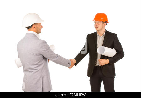 Two Engineers in Gray and Black Attire Shaking Hands Isolated on White Background. Stock Photo