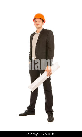 Solo Young Male Engineer in Black Attire and Orange Helmet Looking at Camera. Standing on Full White Background. Stock Photo