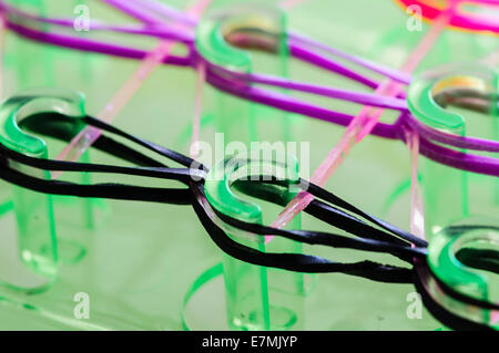 A frame of multi-colored colorful rubber bands for hair, combs and