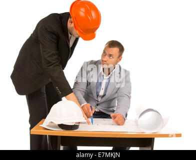 Architect discussing a plan with a building inspector as they debate the feasibility of a project design, isolated on white Stock Photo