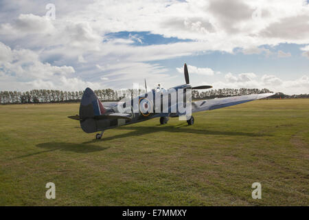 Spitfire and clouds Stock Photo