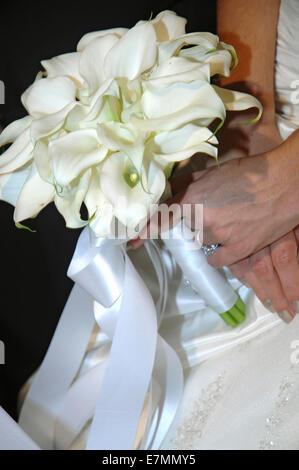Bride holding bridal bouquet (detail)