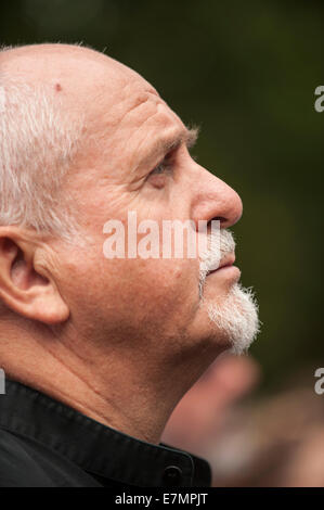 Musician Peter Gabriel looks up at the speakers during the Climate Change demonstration, London, 21st September 2014. © Sue Cunningham Stock Photo