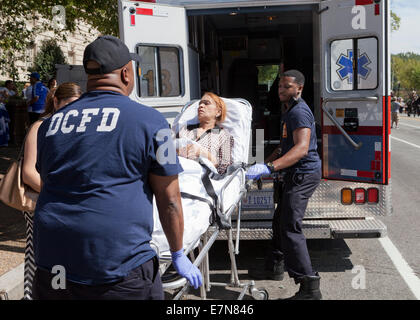 DCFD EMT loading patient into ambulance - Washington, DC USA Stock Photo