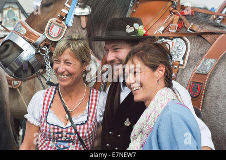 Munich, Germany. 21st September, 2014.  Oktoberfest Crowds of visitors in Front of the Spatenbrau Tent celebrating the festivities with Smiling Faces. The Festival runs from Sept. 20 – Oct. 5 in Munich, Germany. Credit:  Steven Jones/Alamy Live News Stock Photo