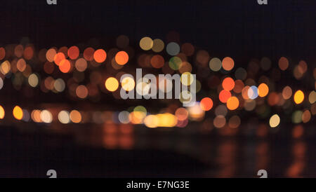 bright city lights background over the water Stock Photo