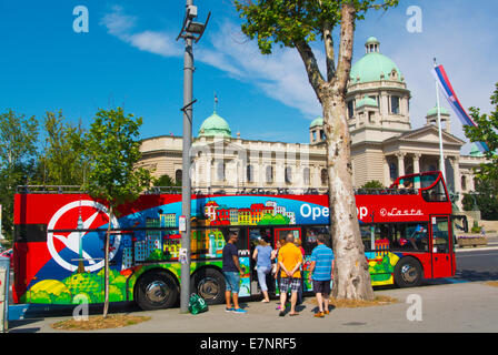 Sightseeing tour bus in front of National Assembly building, Belgrade, Serbia, Southeastern Europe Stock Photo