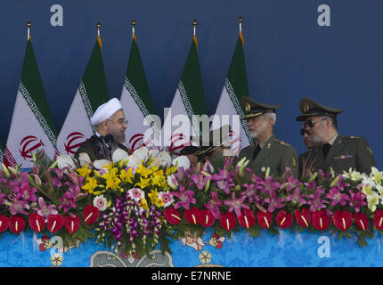 Tehran, Iran. 22nd Sep, 2014. September 22, 2014 - Tehran, Iran - Iran's President HASSAN ROUHANI (L) speaks with the Iranian Army commanders during a military parade to commemorate the anniversary of the Iran-Iraq war (1980-88) in Tehran . Morteza Nikoubazl/ZUMAPRESS Credit:  Morteza Nikoubazl/ZUMA Wire/Alamy Live News Stock Photo