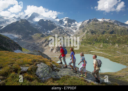 Susten Pass, hiker, lake Stein, Steinsee, Susten, canton Bern, glacier, ice, moraine, footpath, walking, hiking, mountain lake, Stock Photo