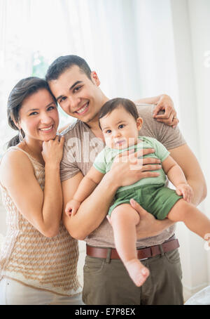Family with baby son (6-11 months) in bedroom Stock Photo