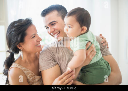 Family with baby son (6-11 months) in bedroom Stock Photo