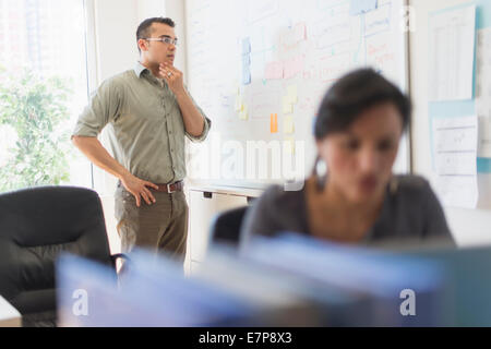 Two people working in office Stock Photo