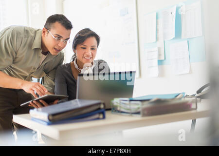 Two people working together with laptop Stock Photo