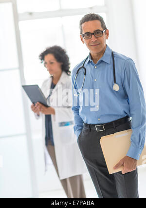 Female and male doctors in hospital Stock Photo