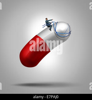 Medication control health care concept as a patient riding and piloting a giant capsule pill using a harness as a metaphor for controlling the dose in medical therapy or avoiding prescription drug abuse leading to addiction. Stock Photo
