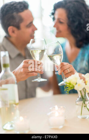Couple celebrating anniversary in restaurant Stock Photo