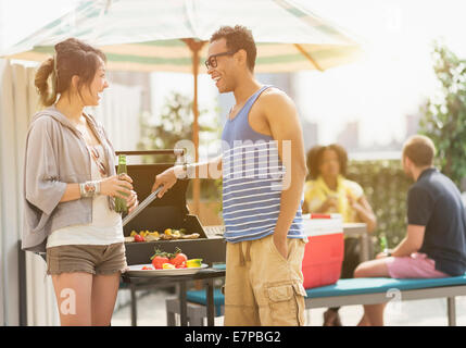 Group of friends enjoying barbeque Stock Photo