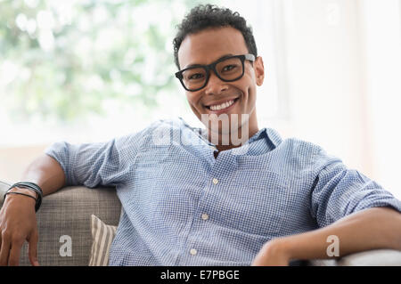 Portrait of young relaxed man smiling Stock Photo